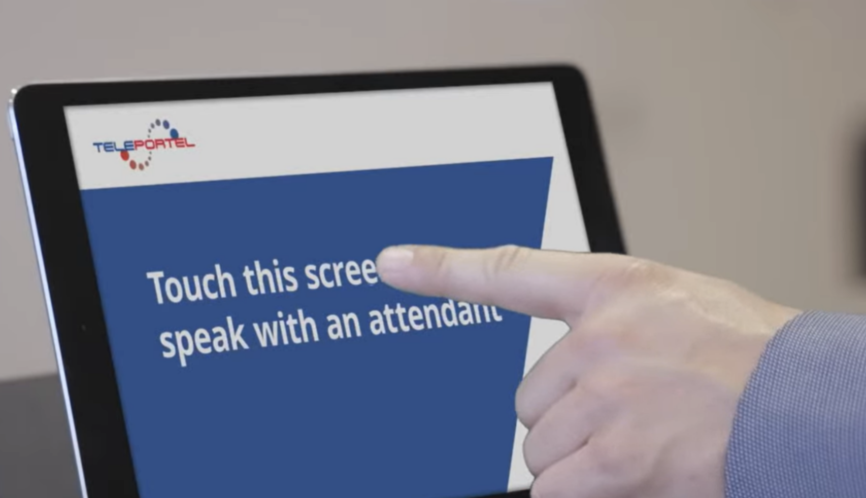 Visitor using a Teleportel reception touchscreen