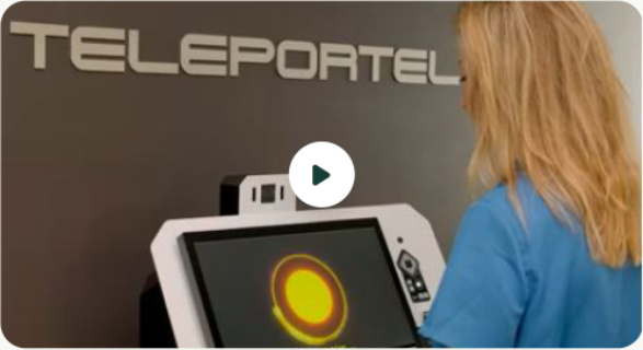 Teleportel reception kiosk with an AI avatar, beside a visitor